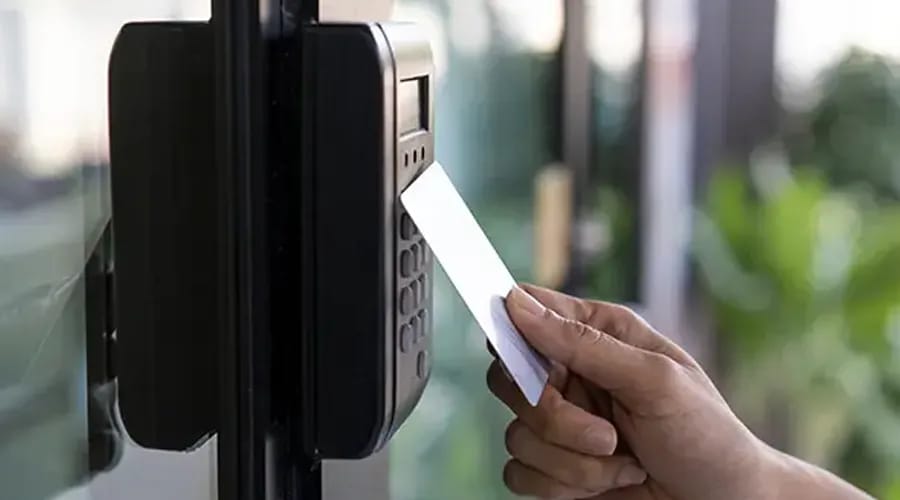 A person is punching a card at the access control-Condor Security (Access Control Systems)