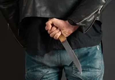 A boy is standing with a crutch in his hand- Condor security (Tactical Awareness Training Toronto)