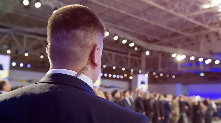 a man stands meeting hall-condor security Executive Protection Toronto