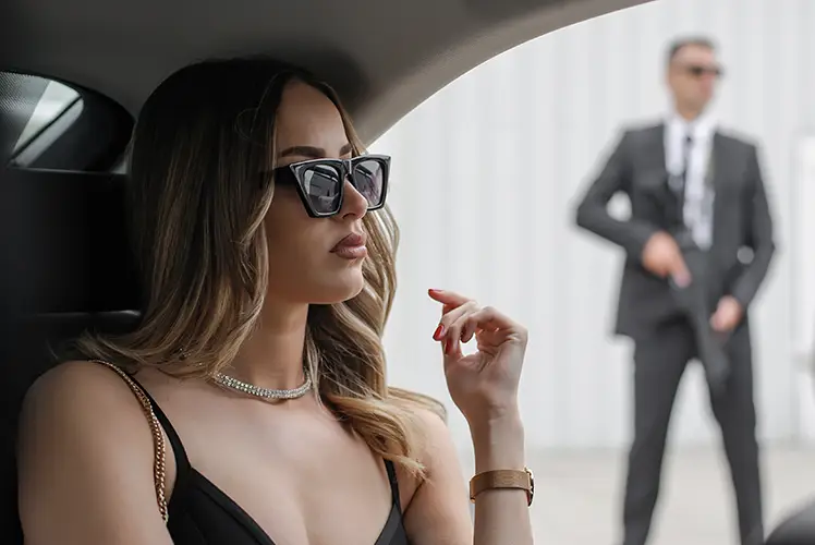 a women sitting in the car- condor security Executive Protection Toronto